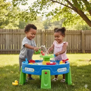 Two Canadian toddlers sharing a large water play table for 2 year olds, promoting social play and "jouet d'eau" fun.