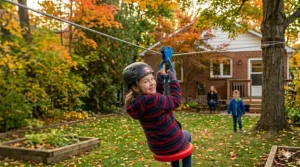 4K photorealistic overview of all components in a premium backyard zip line kit for kids, including the blue trolley, red disk seat, safety harness, galvanized steel cable, leather tree protection, U-bolts, turnbuckle, and wrench, laid out on the lawn during autumn in Canada.