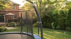 Outward-curved support poles designed into the frame of a trampoline with safety net to prevent impact.