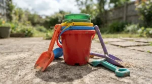 A space-saving travel-friendly beach toy set for kids packed in a car trunk for a weekend getaway.
