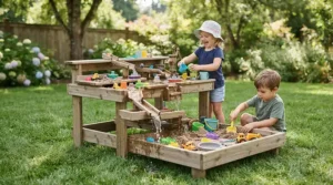 A durable wooden sand and water table combo set up on a Canadian lawn